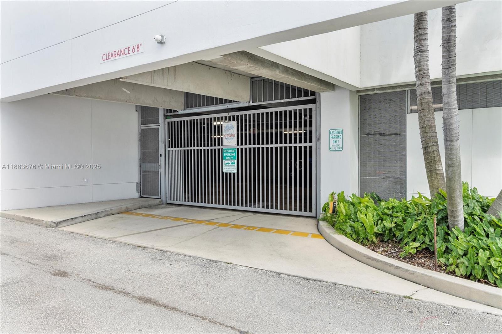 8101 Biscayne Boulevard, Unit R515 Miami, FL 33138 - Photo 26 of 26 a backyard of a house with potted plants and a garage