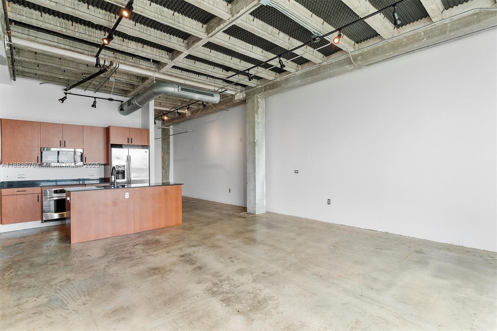 8101 Biscayne Boulevard, Unit R515 Miami, FL 33138 - Photo 4 of 26 a view of a kitchen with a microwave