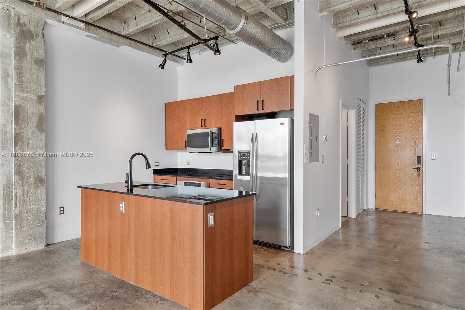 8101 Biscayne Boulevard, Unit R515 Miami, FL 33138 - Photo 8 of 26 a kitchen with stainless steel appliances granite countertop a refrigerator a sink and a stove