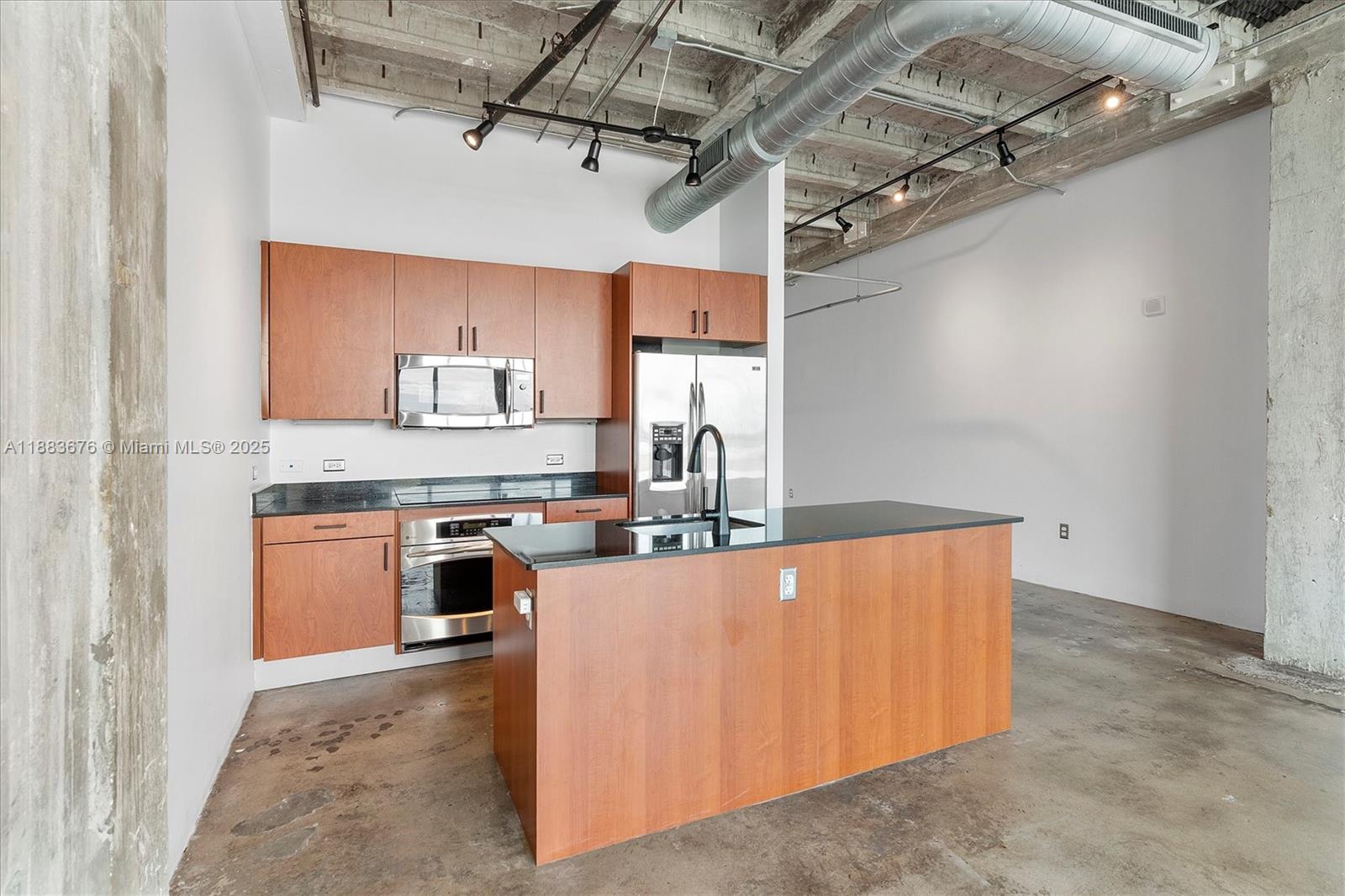 8101 Biscayne Boulevard, Unit R515 Miami, FL 33138 - Photo 9 of 26 a view of a kitchen with stainless steel appliances granite countertop lots of counter top space
