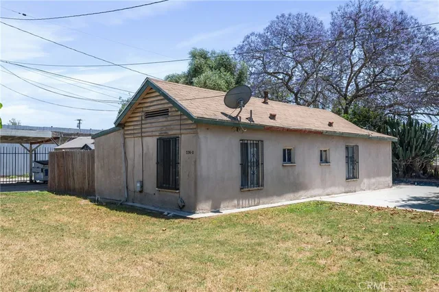 a view of a house with a yard and garage