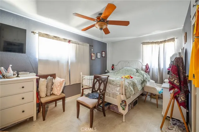 a bedroom that has a bed and a table in it