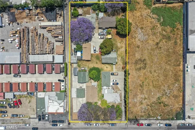 aerial view of multi story residential apartment building with outdoor space