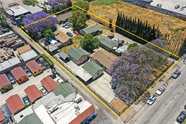 an aerial view of a residential apartment building with a yard