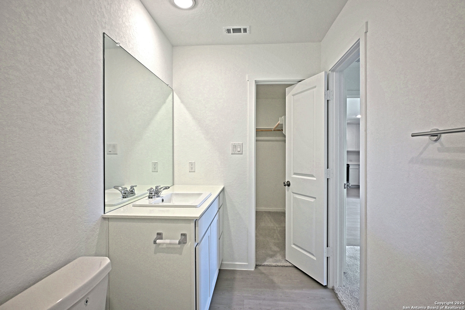 3817 Low Tide Seguin, TX 78155 - Photo 18 of 24 a bathroom with a sink mirror and toilet