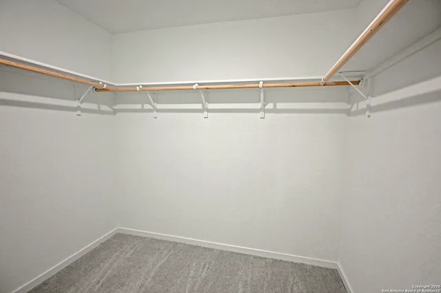 a view of an empty walk in closet