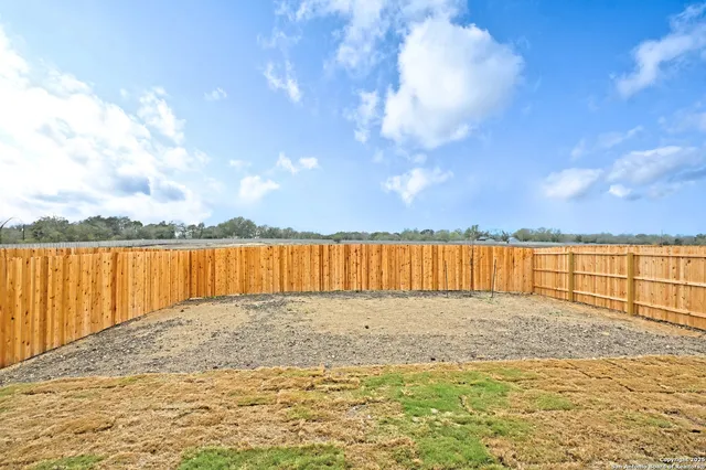 a view of ocean with a big yard