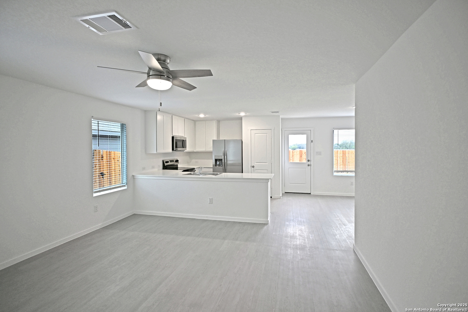 3817 Low Tide Seguin, TX 78155 - Photo 9 of 24 a view of a kitchen with microwave and cabinets