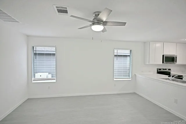 a view of an empty room with a window
