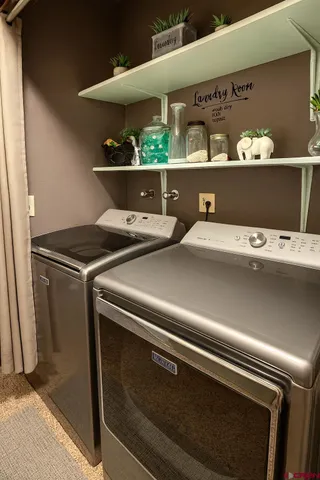a utility room with washer and dryer