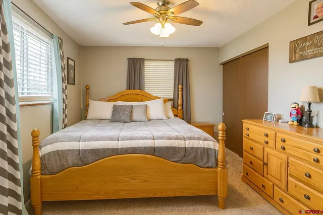 a bedroom with a bed and window