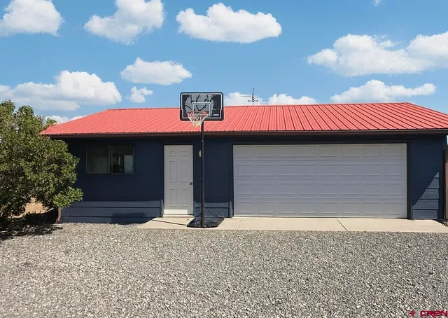 a front view of a house with yard