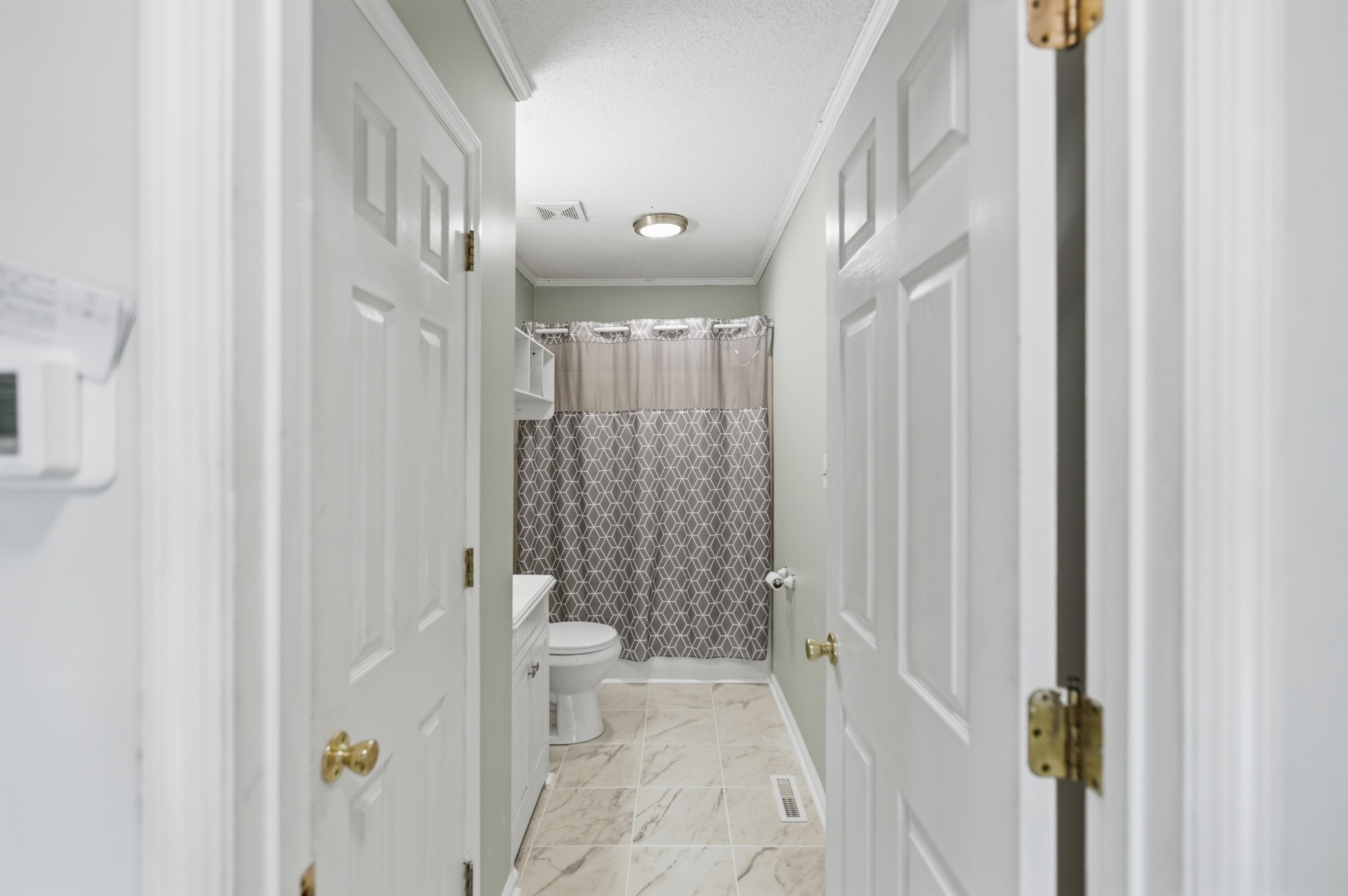 206 Weaver Street Tullahoma, TN 37388 - Photo 17 of 40 a bathroom with a shower and a toilet