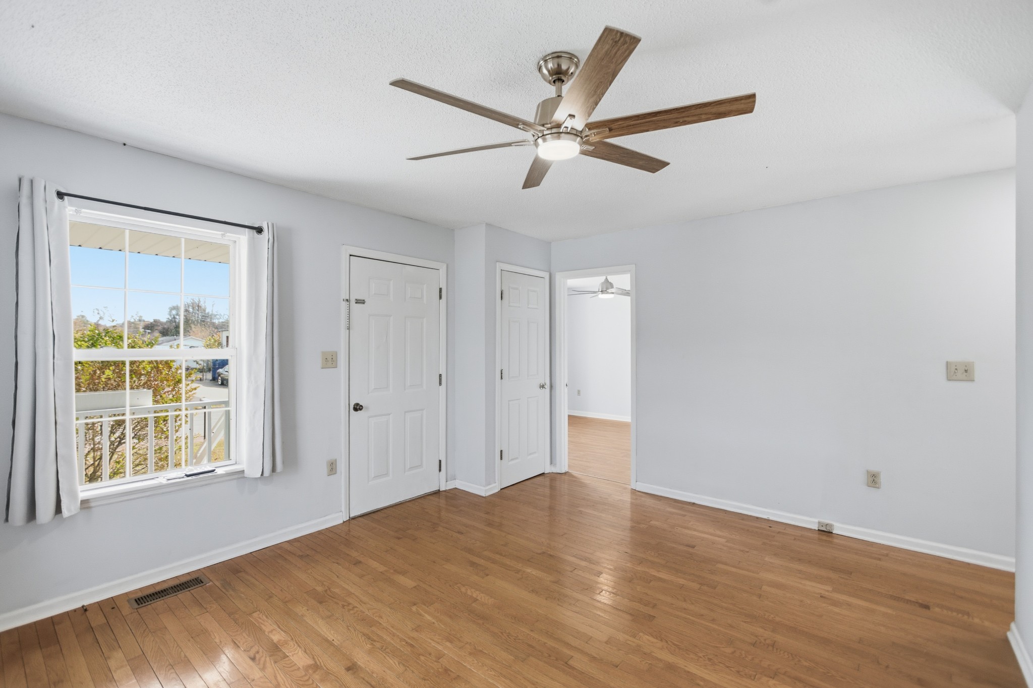 206 Weaver Street Tullahoma, TN 37388 - Photo 6 of 40 a view of a livingroom with a ceiling fan and window