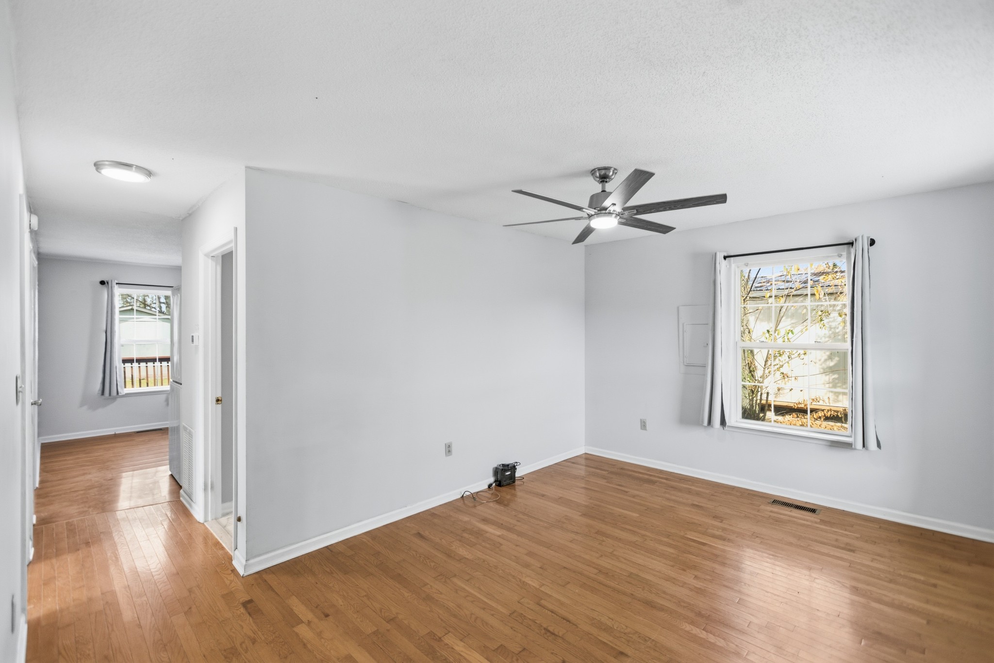 206 Weaver Street Tullahoma, TN 37388 - Photo 8 of 40 a view of empty room with wooden floor and fan