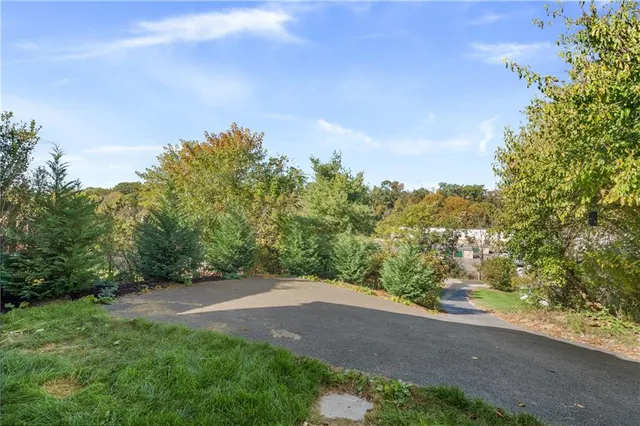 a view of a yard with an trees