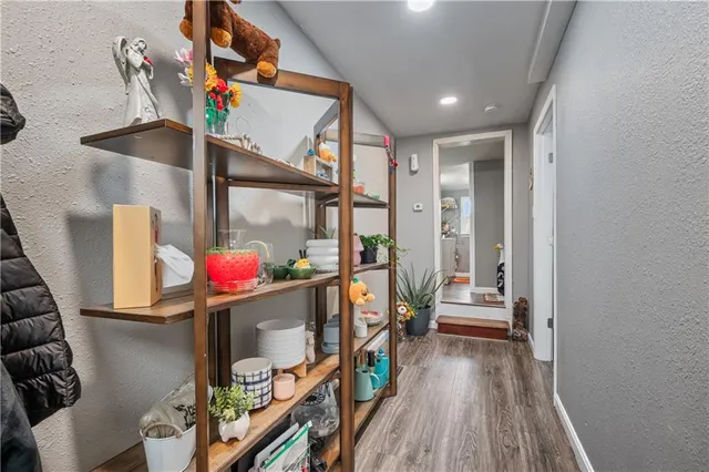 an entryway dining room and hall with wooden floor