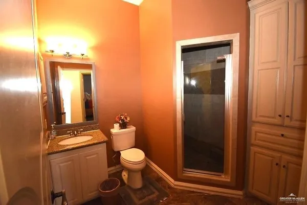 a bedroom with a bed and a mirror