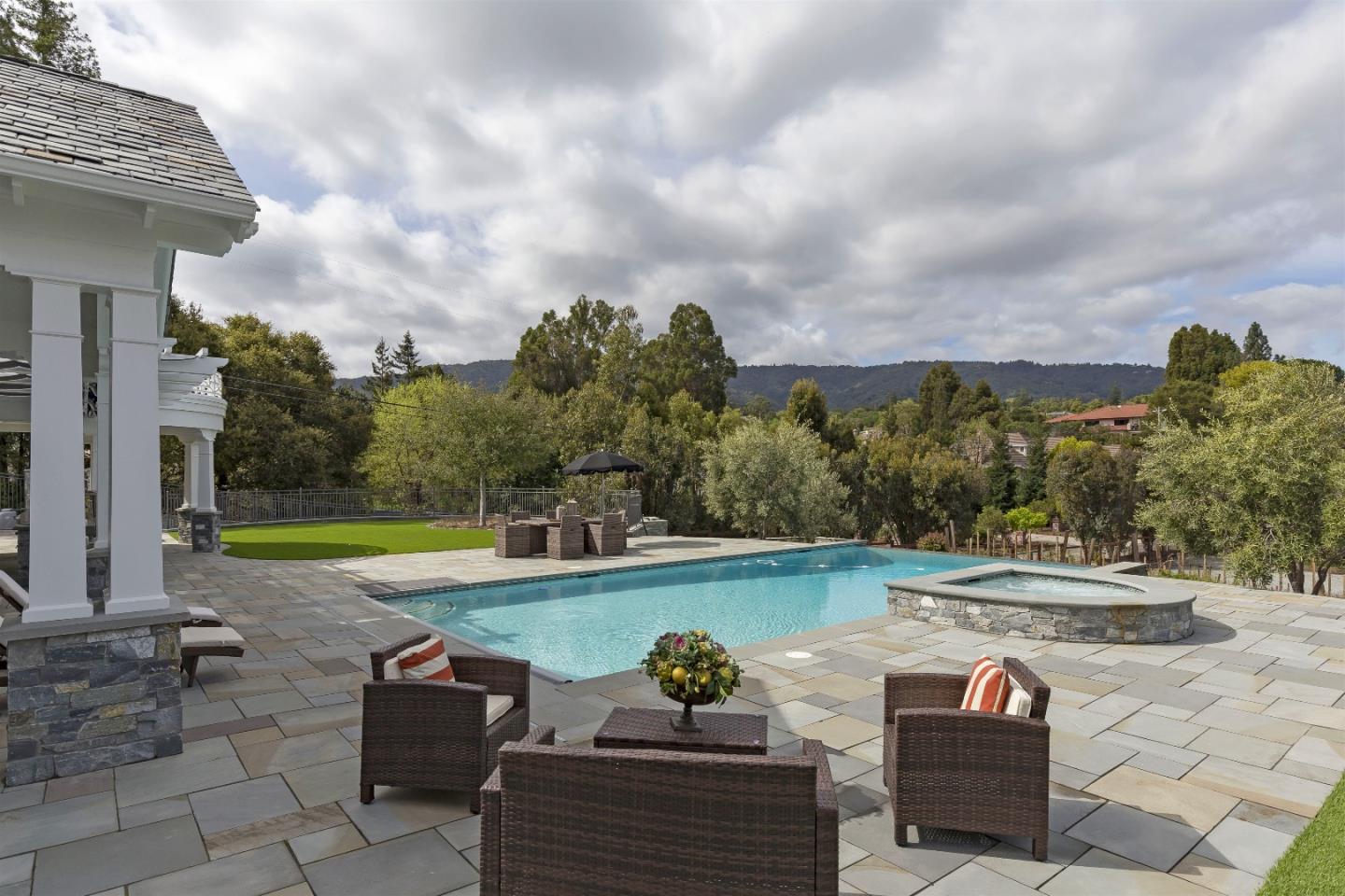 14966 Sobey Road Saratoga, CA 95070 - Photo 18 of 60 a view of a swimming pool with a patio