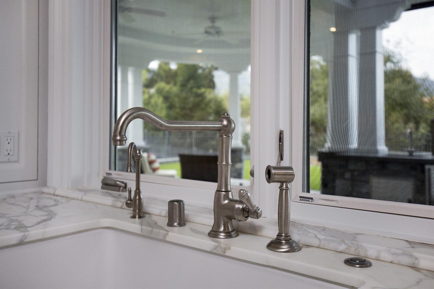 14966 Sobey Road Saratoga, CA 95070 - Photo 25 of 60 a room with a fireplace and windows