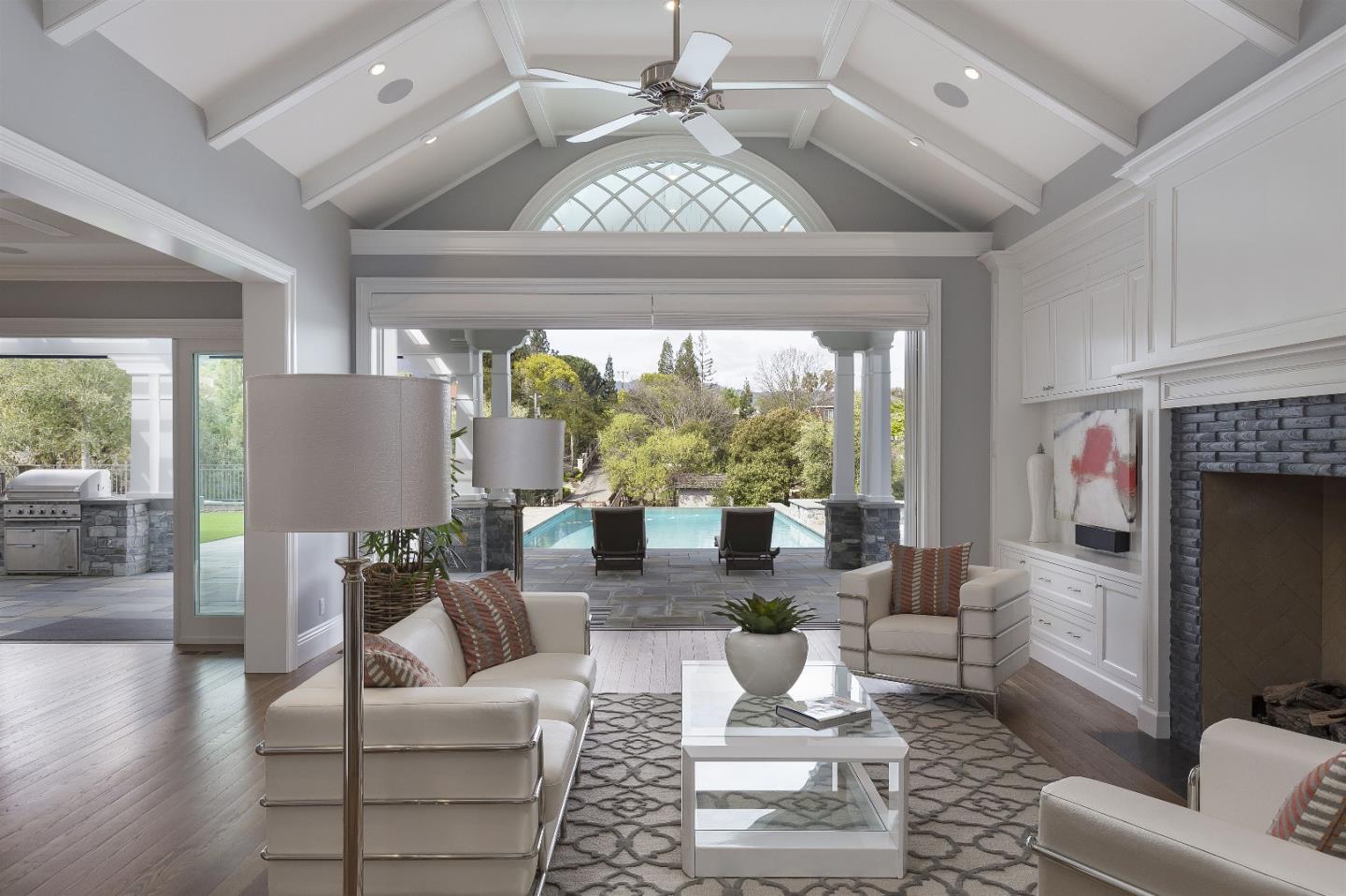 14966 Sobey Road Saratoga, CA 95070 - Photo 27 of 60 a living room with fireplace furniture and a large window