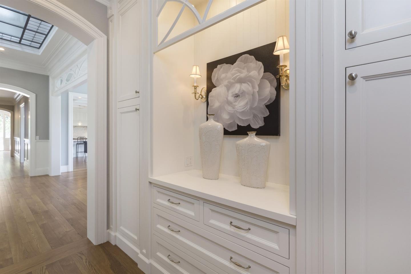14966 Sobey Road Saratoga, CA 95070 - Photo 32 of 60 a view of a hallway with wooden floor and cabinet