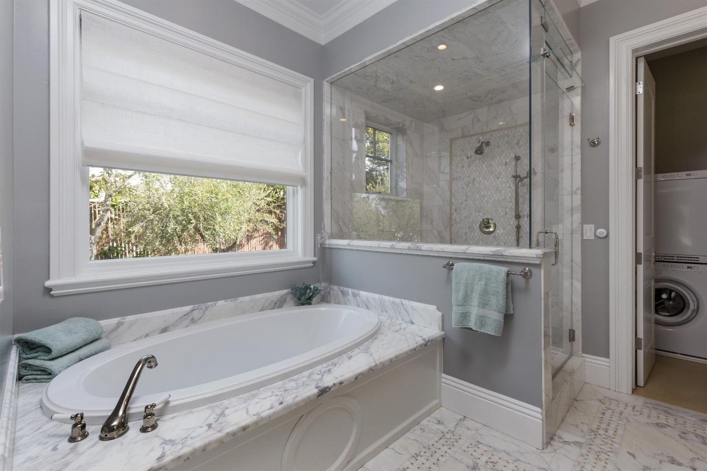 14966 Sobey Road Saratoga, CA 95070 - Photo 37 of 60 a spacious bathroom with a tub and a large window