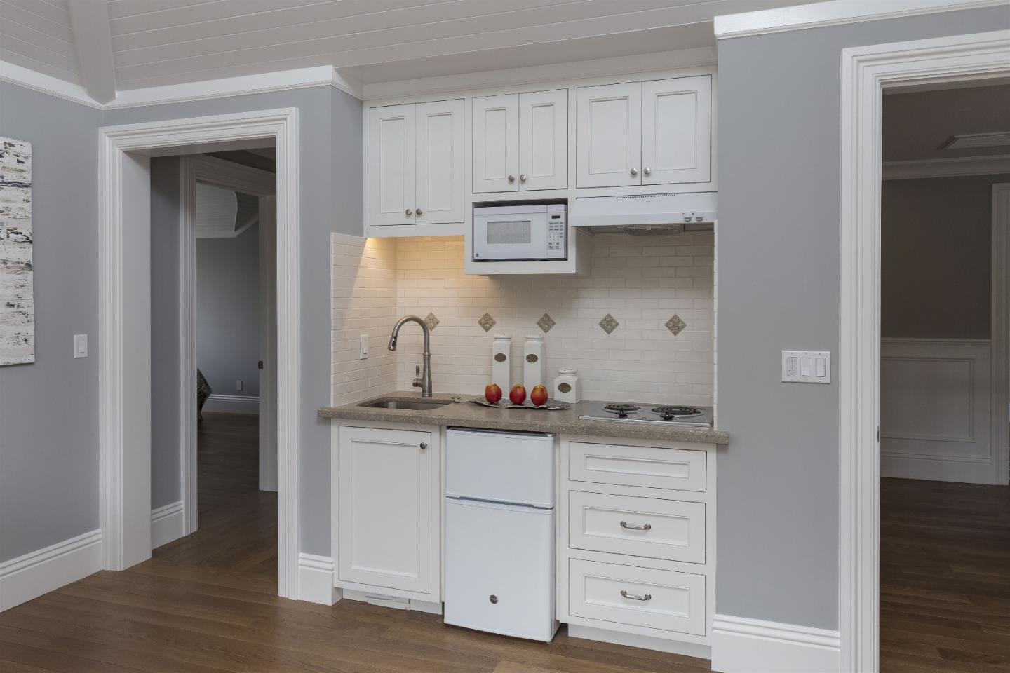 14966 Sobey Road Saratoga, CA 95070 - Photo 45 of 60 a kitchen with white cabinets and white appliances
