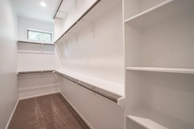 a view of an empty walk in closet