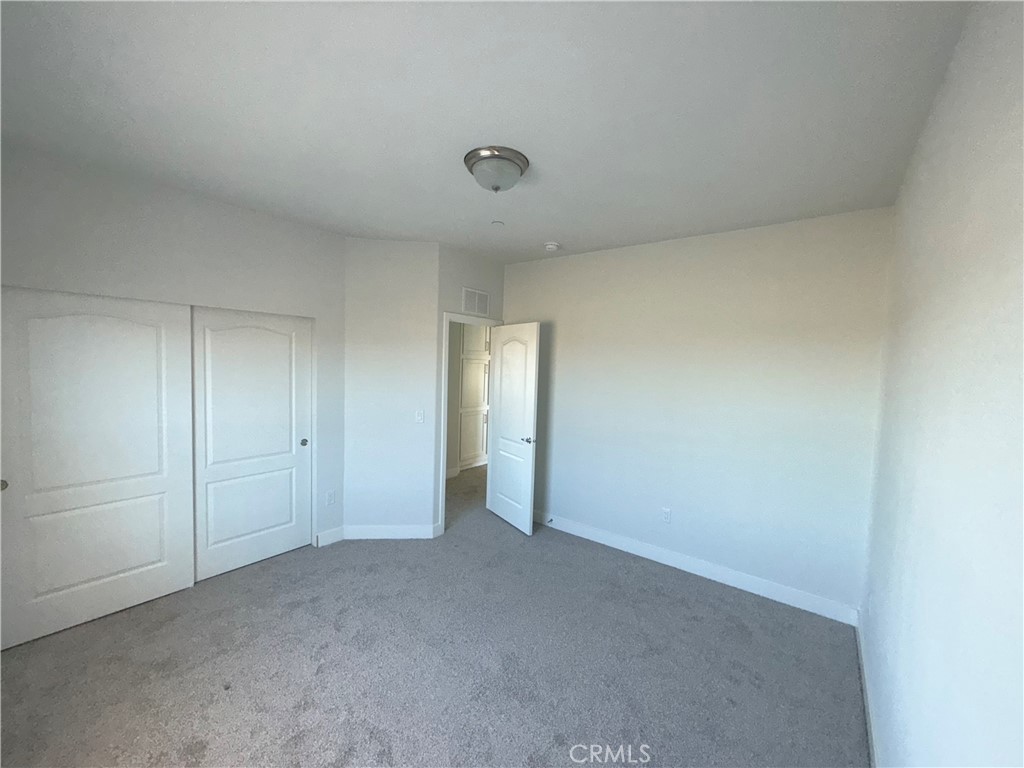 10633 Bromley Road Pinon Hills, CA 92372 - Photo 12 of 13 a view of an empty room and closet area