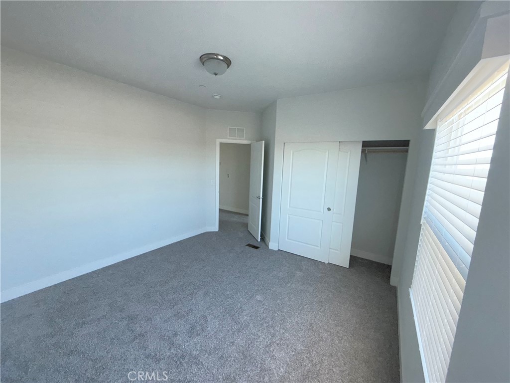 10633 Bromley Road Pinon Hills, CA 92372 - Photo 13 of 13 a view of an empty room with a window