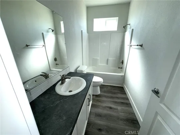a bathroom with a shower and a toilet