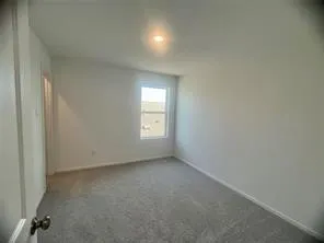 a kitchen with a refrigerator and a sink