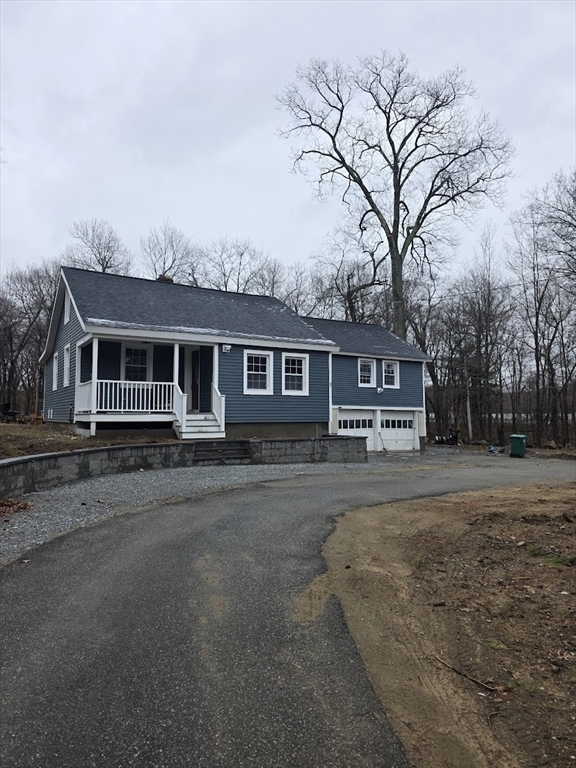 front view of a house with a dry yard