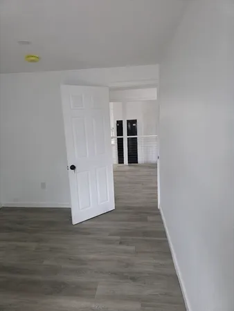 a view of a livingroom with wooden floor