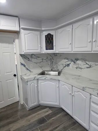 a view of a sink and cabinets