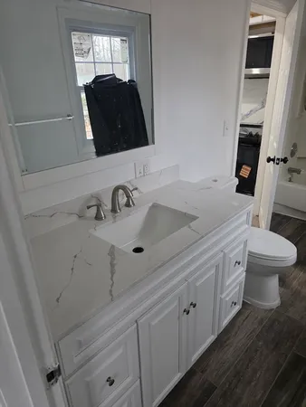 a bathroom with a sink and a mirror