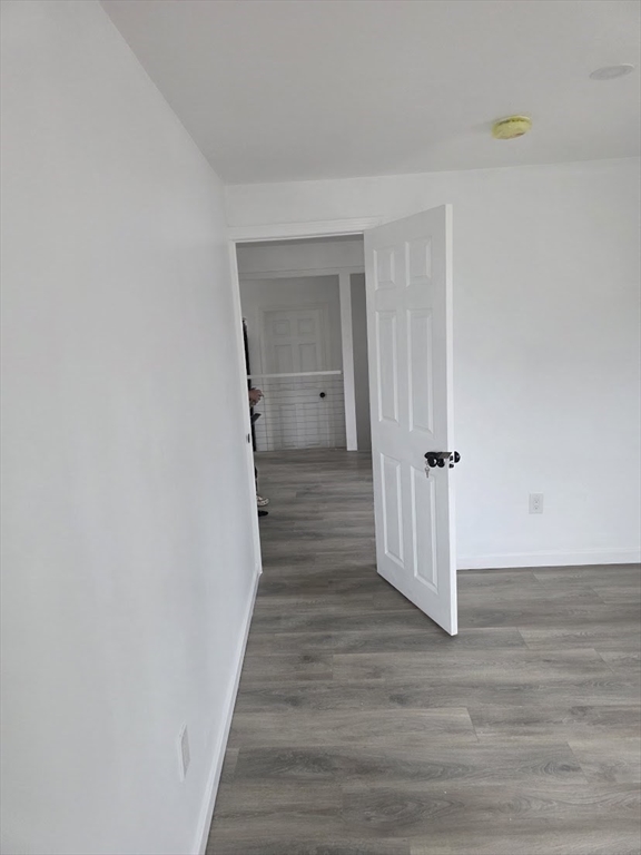 6 French Street, Unit AA Billerica, MA 01821 - Photo 10 of 16 a view of a hallway with wooden floor