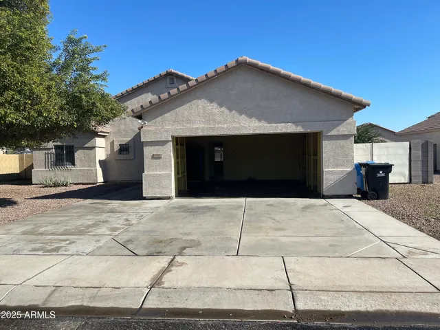 a front view of a house with a garage