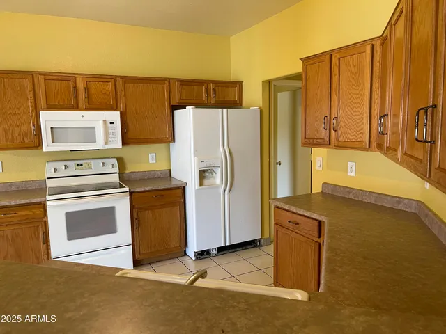 a kitchen with stainless steel appliances a stove and a refrigerator