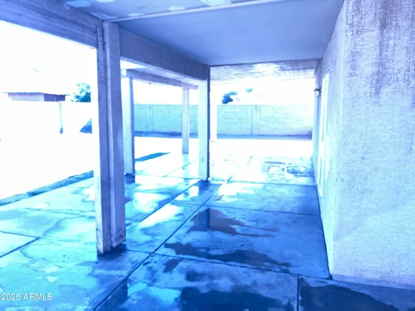 a view of a room with wooden floor and windows