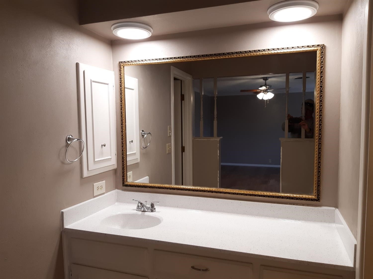 5113 13th Street Lubbock, TX 79416 - Photo 5 of 5 a bathroom with a sink and a mirror