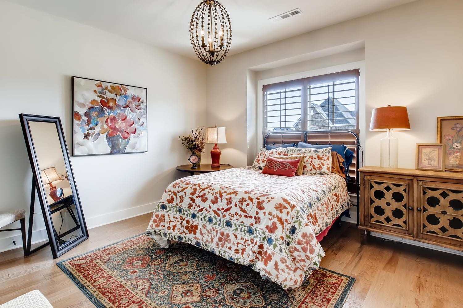 127 Vanner Road Mount Juliet, TN 37122 - Photo 20 of 29 a bedroom with a bed and wooden floor