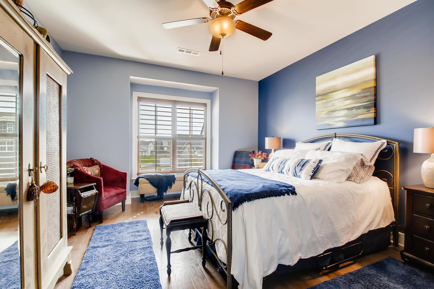 127 Vanner Road Mount Juliet, TN 37122 - Photo 21 of 29 a bedroom with a bed and a chandelier