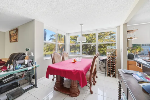 a view of a dining room with furniture window and outside view