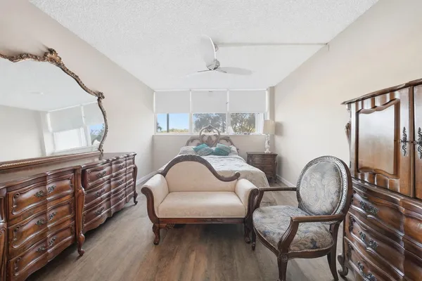 a bedroom with furniture and a window
