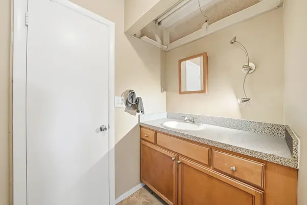 a bathroom with a sink and a mirror