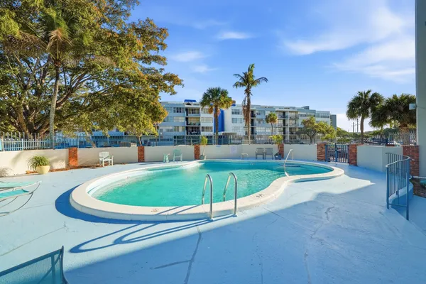 a view of a swimming pool with a patio