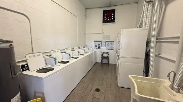 a kitchen with a refrigerator a stove top oven a sink and dishwasher