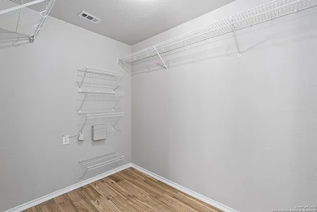 a view of a room with racks on the wall